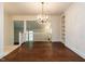 Elegant dining room with hardwood floors and a decorative chandelier at 2143 Ridge Rd, Raleigh, NC 27607