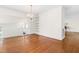 Bright dining room featuring hardwood floors, neutral paint, a chandelier and built-in shelving at 2143 Ridge Rd, Raleigh, NC 27607