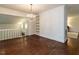 Large dining room featuring hardwood floors, modern lighting, and ample space at 2143 Ridge Rd, Raleigh, NC 27607