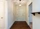 Bright foyer with hardwood floors, white walls, and classic light fixture at 2143 Ridge Rd, Raleigh, NC 27607