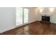 Living room with hardwood floors and brick fireplace at 2143 Ridge Rd, Raleigh, NC 27607
