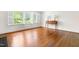Bright living room featuring hardwood floors, plenty of natural light from the large windows and console table at 2143 Ridge Rd, Raleigh, NC 27607