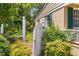Inviting side exterior with white gate and lush garden at 2143 Ridge Rd, Raleigh, NC 27607