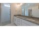 Bathroom featuring double vanity, large mirror, and a glass enclosed shower at 24 Sanders Farm Dr, Smithfield, NC 27577