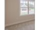 Bright bedroom with large window overlooking a peaceful outdoor setting at 24 Sanders Farm Dr, Smithfield, NC 27577