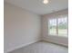 Clean, empty bedroom featuring plush carpeting and a bright window at 24 Sanders Farm Dr, Smithfield, NC 27577