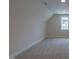 Neutral bedroom has ample natural light, carpet and angled ceilings at 24 Sanders Farm Dr, Smithfield, NC 27577
