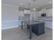 Modern open kitchen featuring stainless appliances, granite countertops, and a functional island at 24 Sanders Farm Dr, Smithfield, NC 27577
