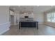 Kitchen featuring a large island, white cabinets, stainless steel appliances, and wood floors at 24 Sanders Farm Dr, Smithfield, NC 27577