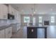 Kitchen featuring a center island, stainless steel appliances, white cabinets, and wood floors at 24 Sanders Farm Dr, Smithfield, NC 27577