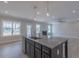 Kitchen featuring a center island, stainless steel appliances, a view into the living room, and wood floors at 24 Sanders Farm Dr, Smithfield, NC 27577