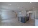 Spacious living room with hardwood floors adjoins a modern open kitchen with stainless appliances at 24 Sanders Farm Dr, Smithfield, NC 27577