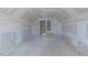 Large attic featuring unfinished walls and ceiling, highlighting an opportunity for creative renovation at 25 Sanders Farm Dr, Smithfield, NC 27577