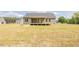 Expansive backyard featuring a deck and lush lawn, offering a serene outdoor space and lovely house at 25 Sanders Farm Dr, Smithfield, NC 27577