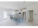 Bright kitchen features an island, modern white cabinets, and stainless steel appliances at 25 Sanders Farm Dr, Smithfield, NC 27577