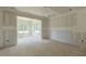 Bright living room with large window openings, perfect for entertaining at 25 Sanders Farm Dr, Smithfield, NC 27577