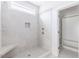 Modern bathroom featuring a tiled shower with niche and a glass door at 25 Sanders Farm Dr, Smithfield, NC 27577