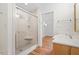 Updated bathroom with glass shower, new tile, and vanity at 2823 Fowler Ave, Raleigh, NC 27607