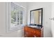 Bathroom with a single sink and dark wood cabinet at 2823 Fowler Ave, Raleigh, NC 27607