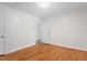 Bedroom with hardwood floors, light walls, and natural light at 2823 Fowler Ave, Raleigh, NC 27607