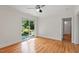 Bedroom with hardwood floors and access to a private patio at 2823 Fowler Ave, Raleigh, NC 27607