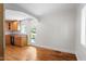 Dining room with hardwood floors next to kitchen at 2823 Fowler Ave, Raleigh, NC 27607