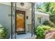 Inviting front entrance with decorative door, porch, and house number at 2823 Fowler Ave, Raleigh, NC 27607