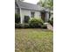 Well-maintained home showcasing lush landscaping and an attractive front entrance with decorative ironwork at 2823 Fowler Ave, Raleigh, NC 27607