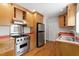 Well-equipped kitchen featuring stainless steel appliances and ample cabinet space at 2823 Fowler Ave, Raleigh, NC 27607