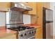 Close up of stainless steel appliances and hood in a kitchen at 2823 Fowler Ave, Raleigh, NC 27607