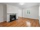 Bright living room with hardwood floors and decorative fireplace at 2823 Fowler Ave, Raleigh, NC 27607