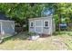 Backyard shed with a ramp entrance and a window at 2823 Fowler Ave, Raleigh, NC 27607
