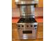 Stainless steel Viking range with four burners, griddle, and hood at 2823 Fowler Ave, Raleigh, NC 27607