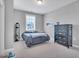 Bedroom with a neutral color palette and natural light from the window at 2848 Angelica Rose Way, Apex, NC 27502