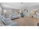Open-concept living area features hardwood floors, views into the kitchen, and neutral paint colors at 2848 Angelica Rose Way, Apex, NC 27502