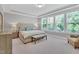 Spacious main bedroom with large windows and tray ceiling plus sitting bench at 2848 Angelica Rose Way, Apex, NC 27502