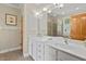 Bathroom with double sinks, hardwood door, and a glass walk-in shower at 30119 Settle, Chapel Hill, NC 27517