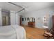 Light-filled bedroom with access to a backyard, rocking chair, and hardwood floors at 30119 Settle, Chapel Hill, NC 27517