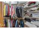 Walk-in closet with built-in shelving and racks, maximizing storage space at 30119 Settle, Chapel Hill, NC 27517