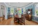 Lovely dining room with hardwood floors, blue walls, and a large antique wooden buffet at 30119 Settle, Chapel Hill, NC 27517
