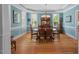 Bright dining room with natural light, hardwood floors, and elegant furnishings at 30119 Settle, Chapel Hill, NC 27517