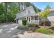 Charming two-story home with an attached garage, screened porch, and landscaped front yard at 30119 Settle, Chapel Hill, NC 27517
