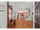 Inviting foyer with hardwood floors, a staircase, and views into the living spaces at 30119 Settle, Chapel Hill, NC 27517