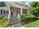 Charming home featuring a covered front porch with brick steps and well-maintained landscaping at 30119 Settle, Chapel Hill, NC 27517