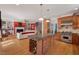 Spacious kitchen with a large island that includes wine storage, opening up to the living room and staircase at 30119 Settle, Chapel Hill, NC 27517