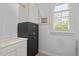 Laundry room featuring bright white shelving and a full-sized safe for the secure storage of valuables at 30119 Settle, Chapel Hill, NC 27517