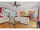 Spacious open-concept living area with hardwood floors and natural light, connecting to the kitchen and stairs at 30119 Settle, Chapel Hill, NC 27517