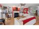 Comfortable living area featuring built-in bookshelves, a fireplace, and hardwood floors at 30119 Settle, Chapel Hill, NC 27517