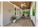 Relaxing covered porch with ceiling fans, comfortable seating, and a wooden ceiling at 30119 Settle, Chapel Hill, NC 27517