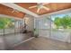 Screened-in porch featuring wood floors, white lattice railings, and ample room for outdoor entertaining at 30119 Settle, Chapel Hill, NC 27517